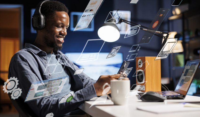 Business person using laptop multitasking to finish daily startup tasks, internet of things concept. Uses artificial intelligence optimization system for productivity, access pc smart things menu.